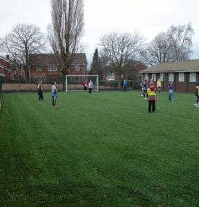 Playing on artificial grass sports surfacing