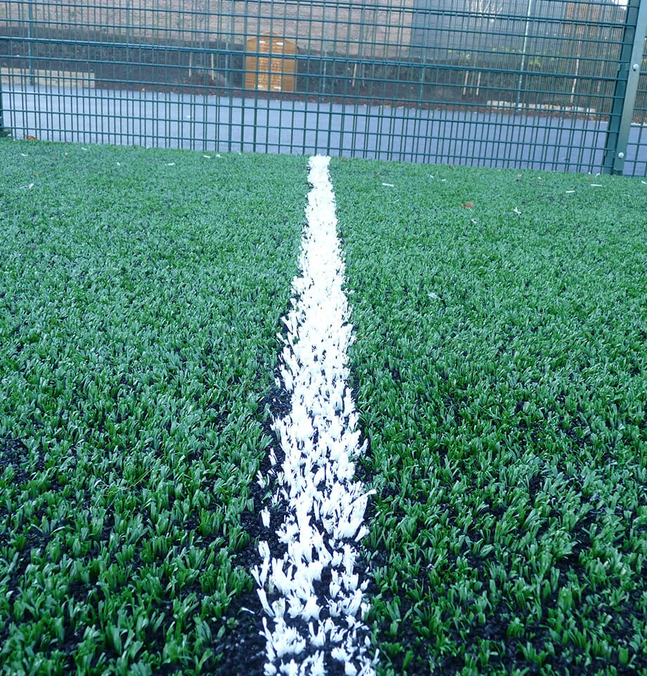 Playing on artificial grass sports surfacing